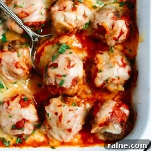 Cheesy Baked Meatball Casserole with Marinara and Pasta 7 Close up of Baked Meatballs Casserole with a spoon lifting one meatball