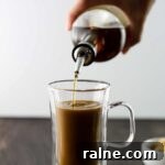 Brown Sugar Simple Syrup pouring into a coffee drink.