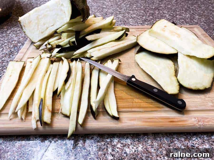 Summer Eggplant Jerky Recipe: Crispy Savory Plant-Based Snack 3 Sliced Eggplant on wooden board