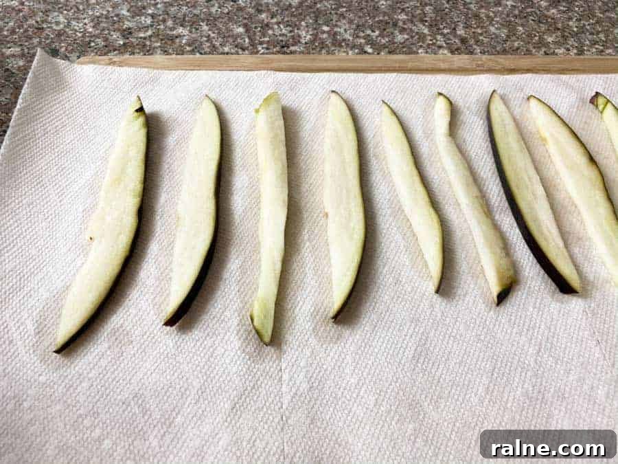 Summer Eggplant Jerky Recipe: Crispy Savory Plant-Based Snack 7 wet Eggplant slices on paper towel
