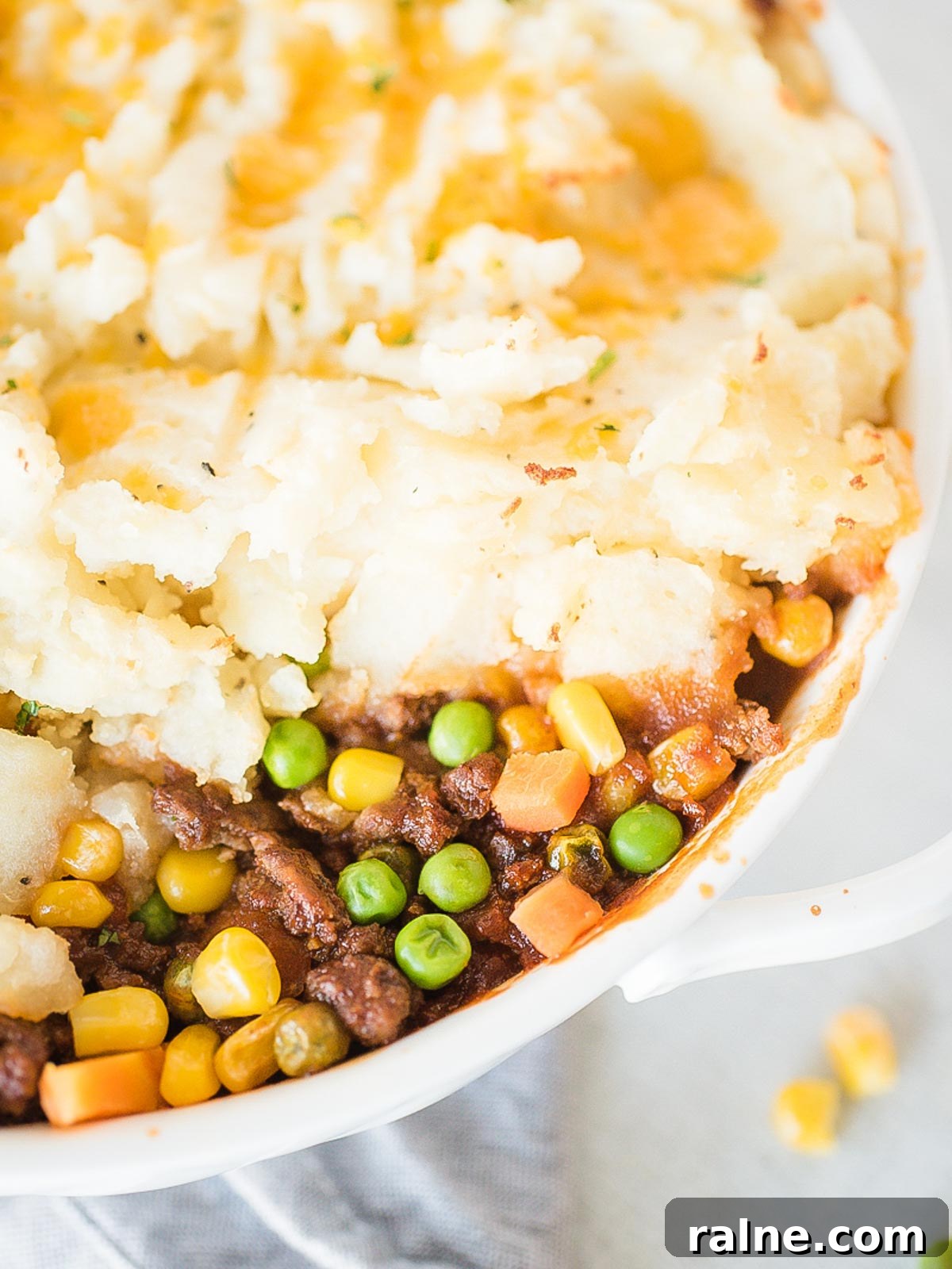 up close of inside of shepherds pie in a white baking dish