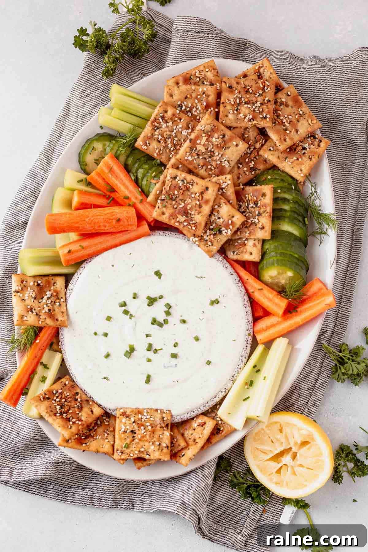 Creamy Cottage Cheese Dip Recipe for Fresh Veggies and Chips 2 a platter of crackers and veggies with cottage cheese dip