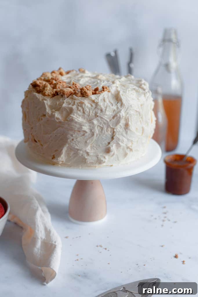 Apple Cider Layer Cake with Pie-Crumb Frosting and Salted Caramel Filling 3 An apple cider cake on a cake stand