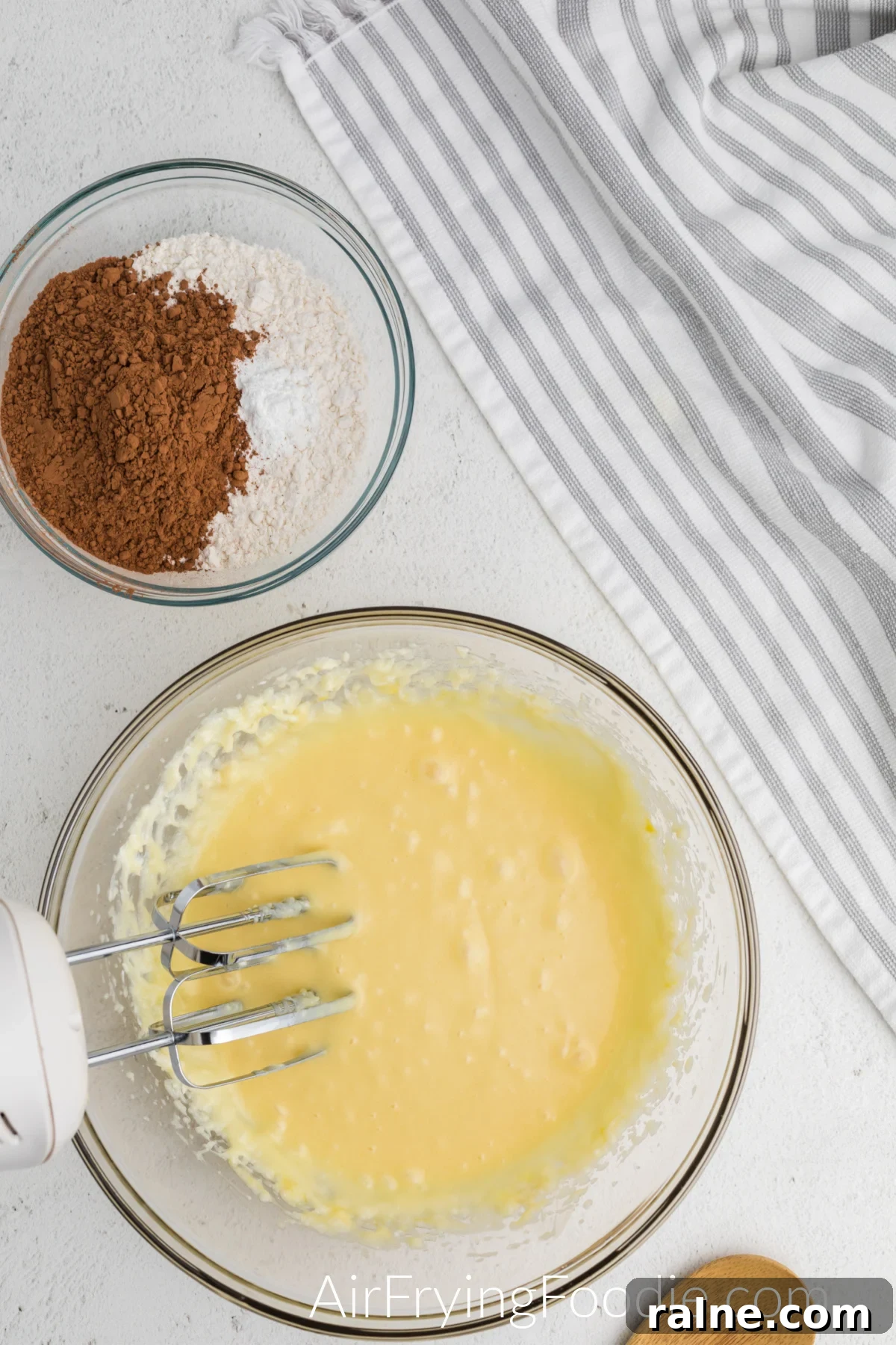eggs, sugar, cream cheese, butter, and vanilla mixed together for the cake batter.