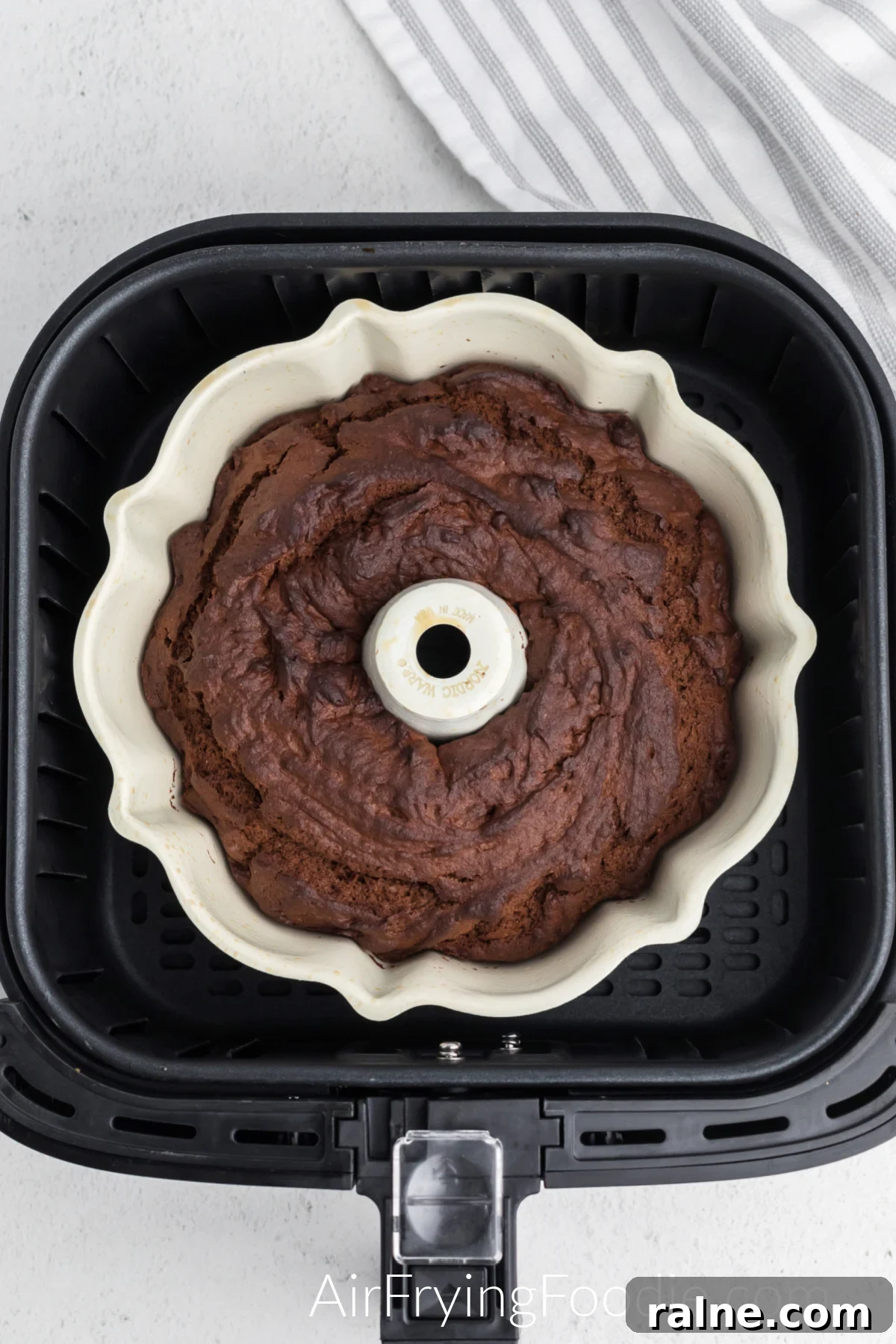 Cooked chocolate bundt cake in the air fryer basket.