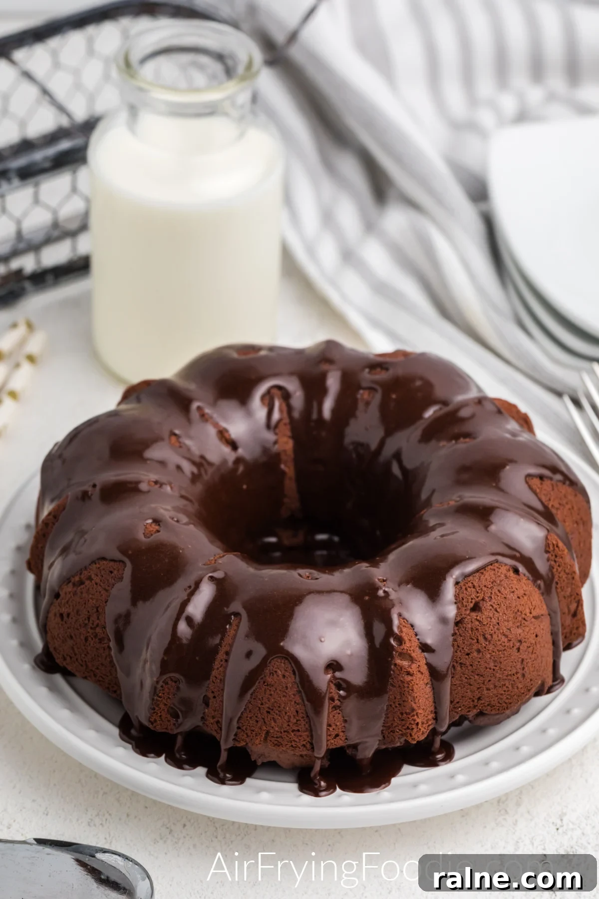 bundt cake made in the air fryer and topped with chocolate frosting. 