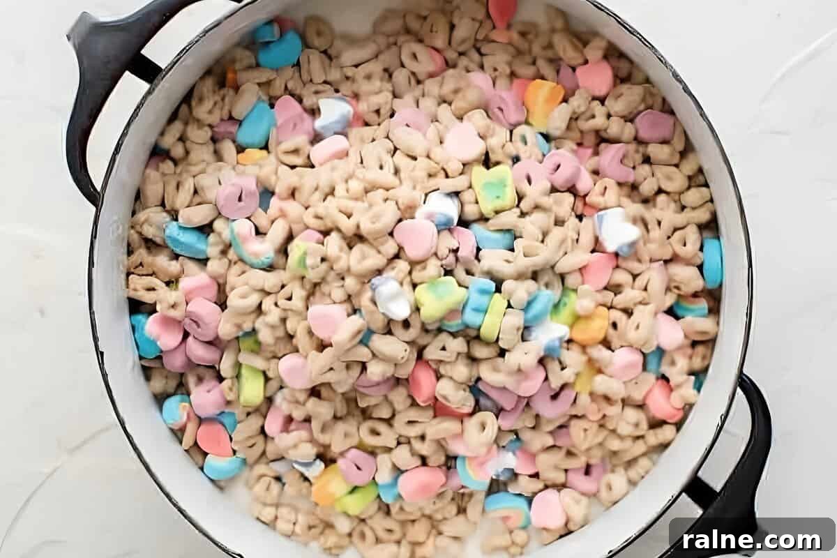 Lucky Charms cereal added to a pot of marshmallows.