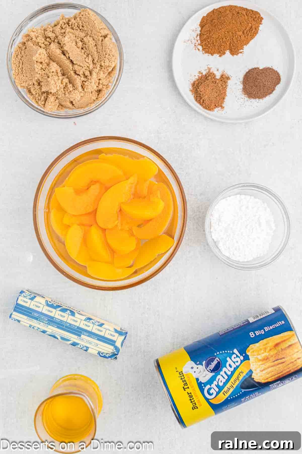 Crispy Fried Peach Cobbler: Southern Dessert Recipe 3 Ingredients for Fried Peach Cobbler-peaches in syrup, brown sugar, cinnamon, nutmeg, allspice, butter, biscuits, powdered sugar, ice cream.
