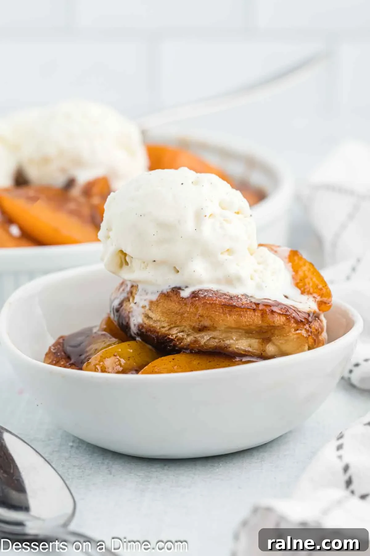 Crispy Fried Peach Cobbler: Southern Dessert Recipe 8 Deep fried peach cobbler topped with ice cream.