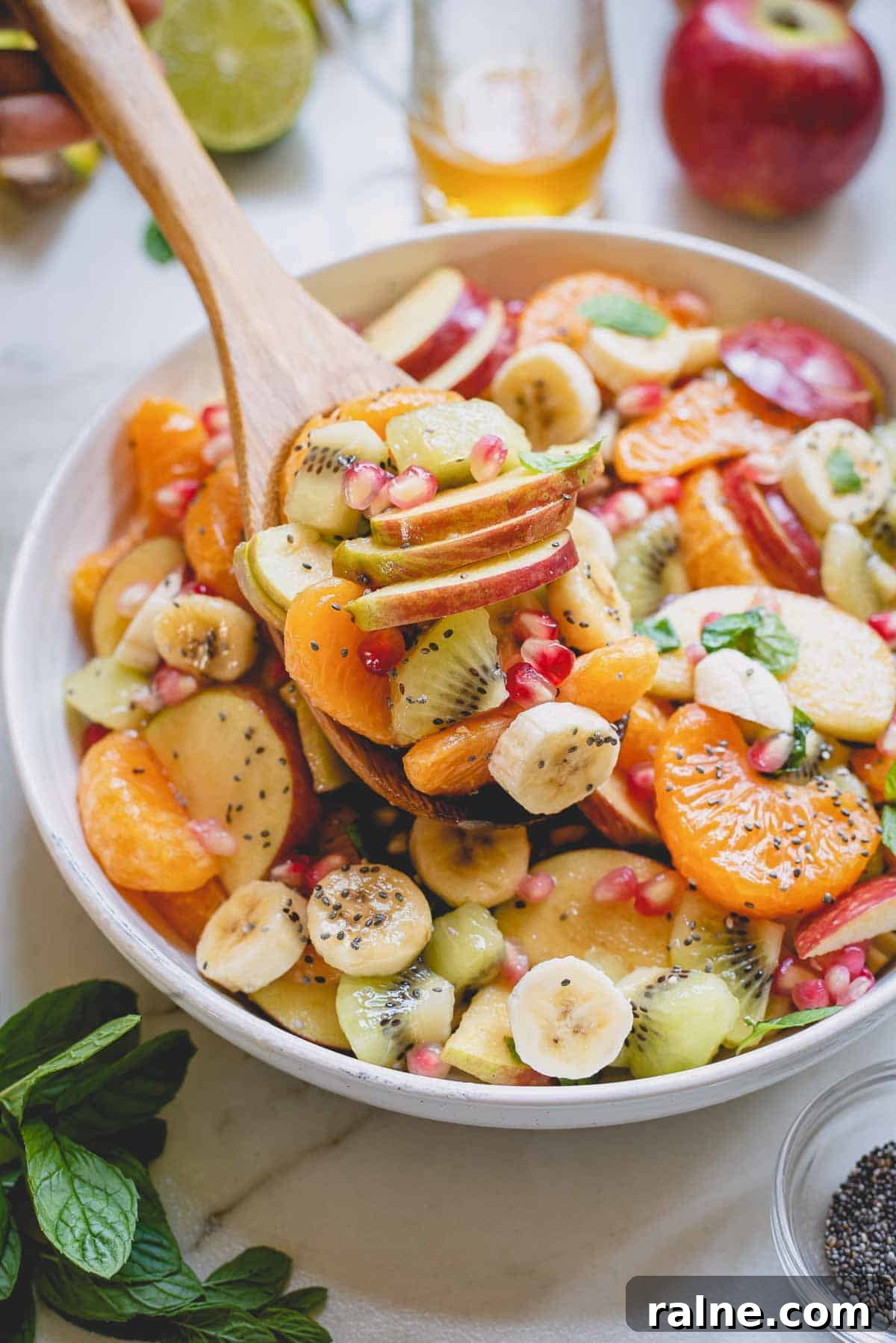 a large spoonful of fruit salad. 
