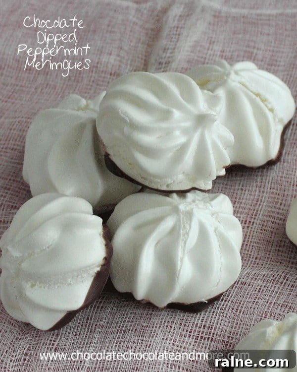 Chocolate Dipped Peppermint Meringues-the lightness of a Meringue with just the hint of peppermint complemented with a light dip in chocolate.