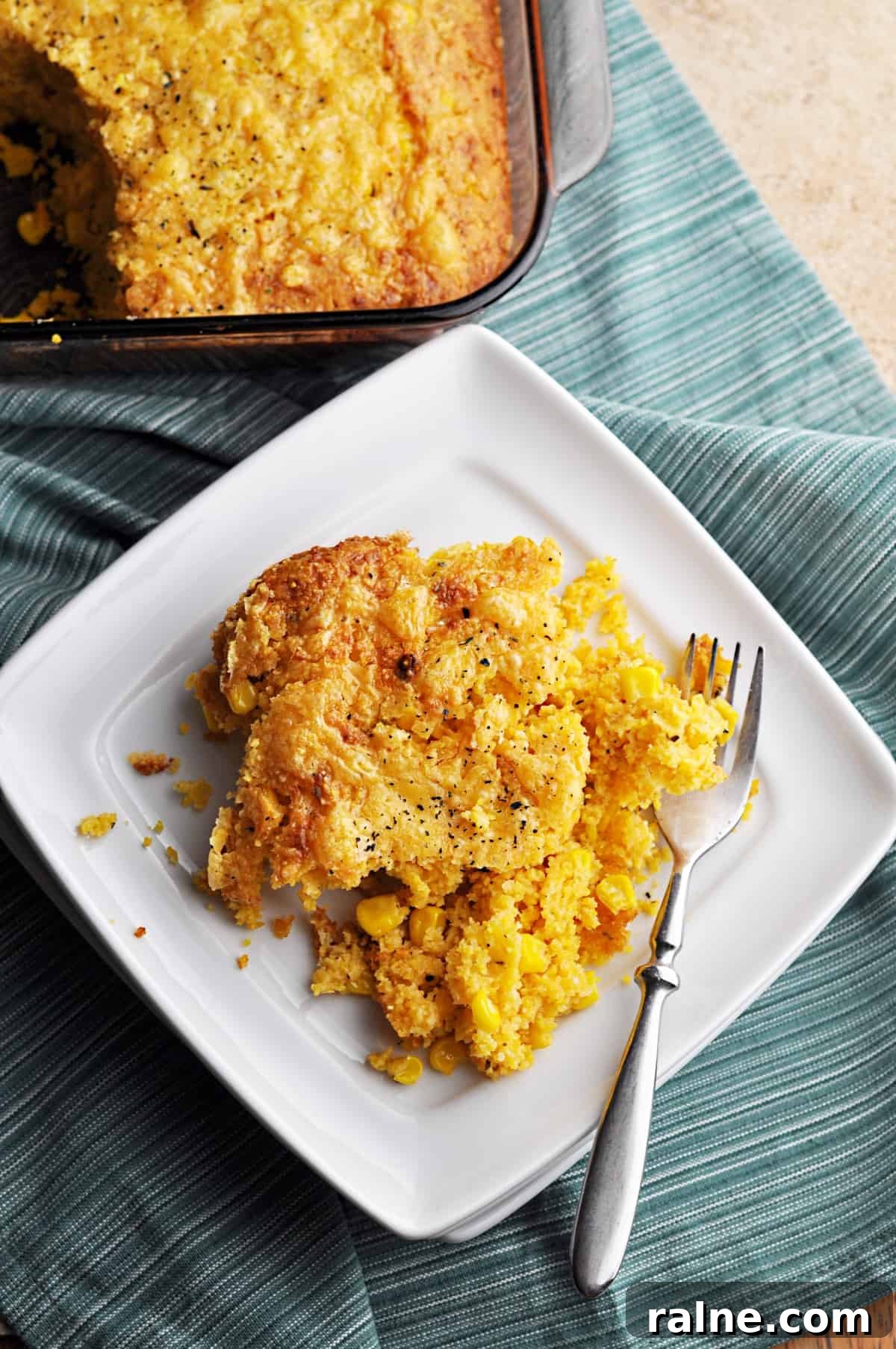 Sweetcorn casserole on white plate with fork