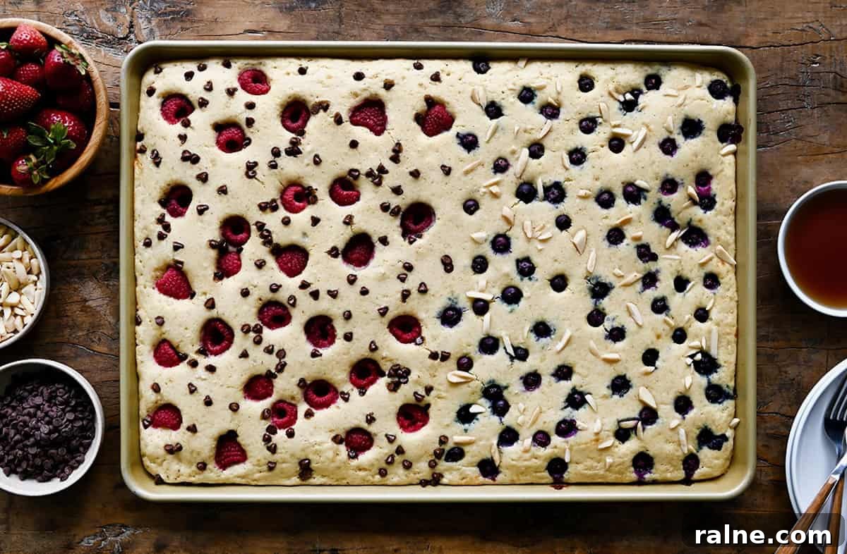 Light and fluffy sheet pan pancakes before being sliced and served.