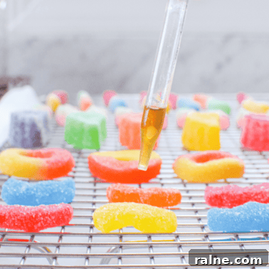 Sugar coated gummies with a dropper adding tincture