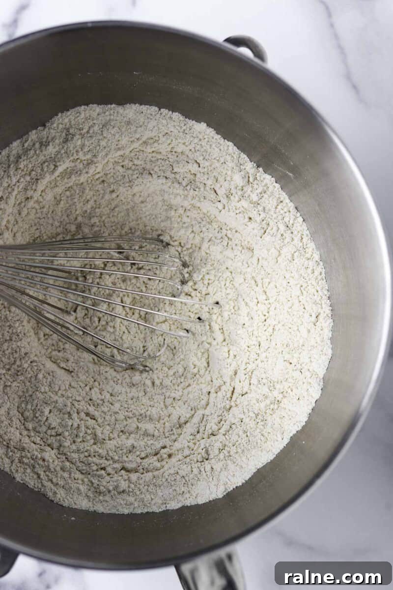 Soft Swedish Tunnbröd Recipe: How to Make Traditional Flatbreads 4 Flour in a metal bowl with a whisk.