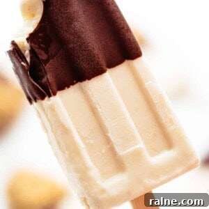 Creamy Banana Popsicle Recipe: 4-Ingredient Frozen Treat 11 A bite taken from Chocolate-Covered-Banana-Popsicles