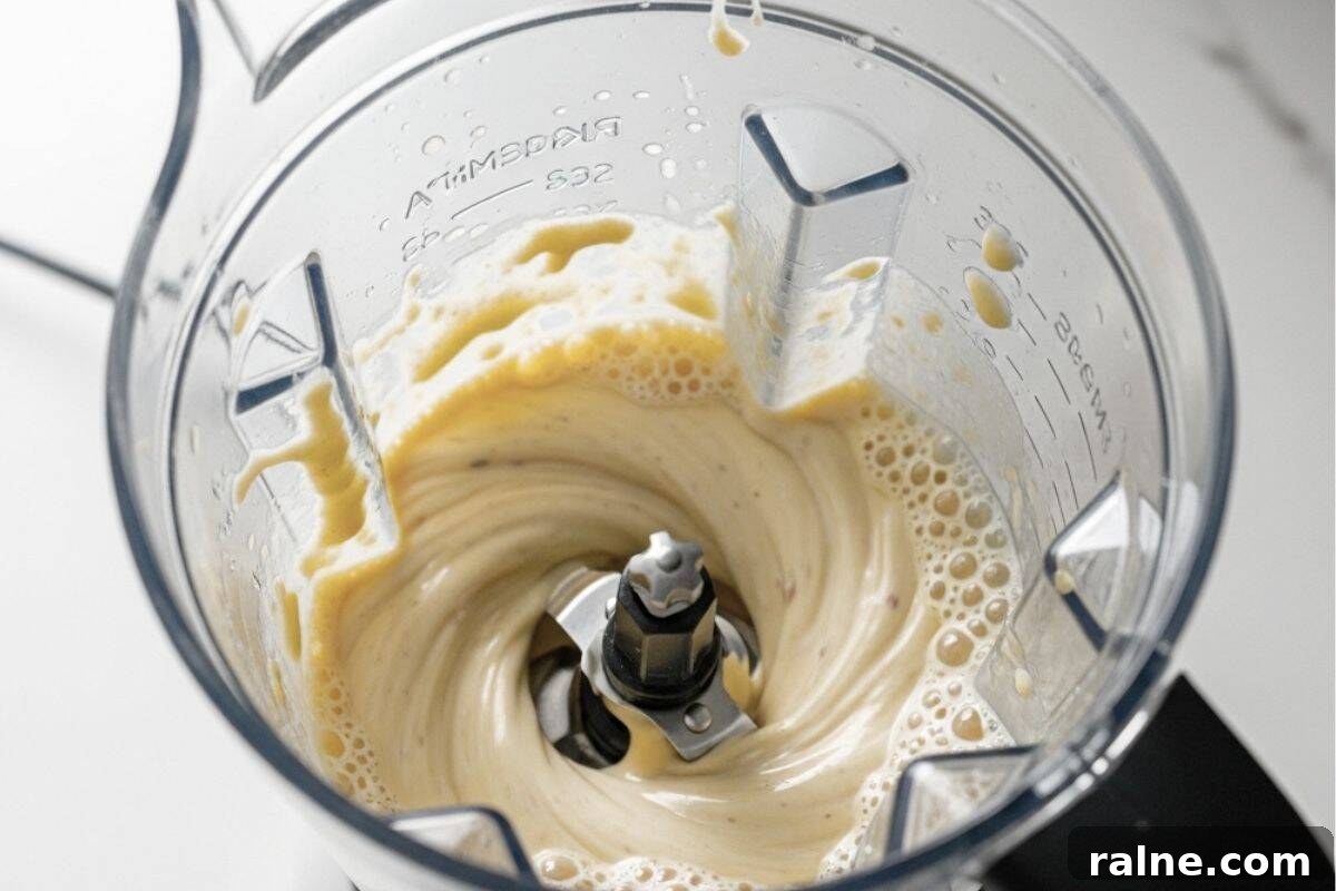 Creamy Banana Popsicle Recipe: 4-Ingredient Frozen Treat 4 In a blender, add bananas, peanut butter, yogurt, milk, honey, and vanilla.