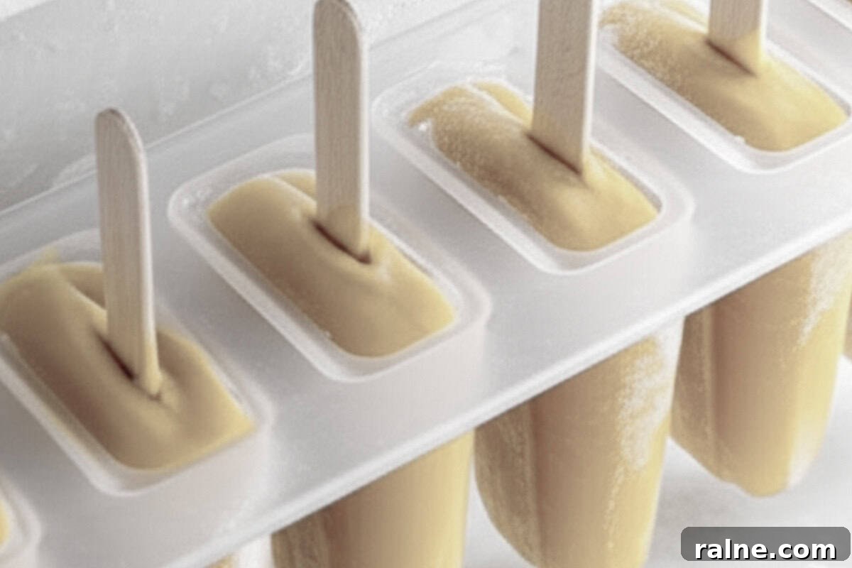 Creamy Banana Popsicle Recipe: 4-Ingredient Frozen Treat 7 Place the molds into the freezer and freeze until completely solid.