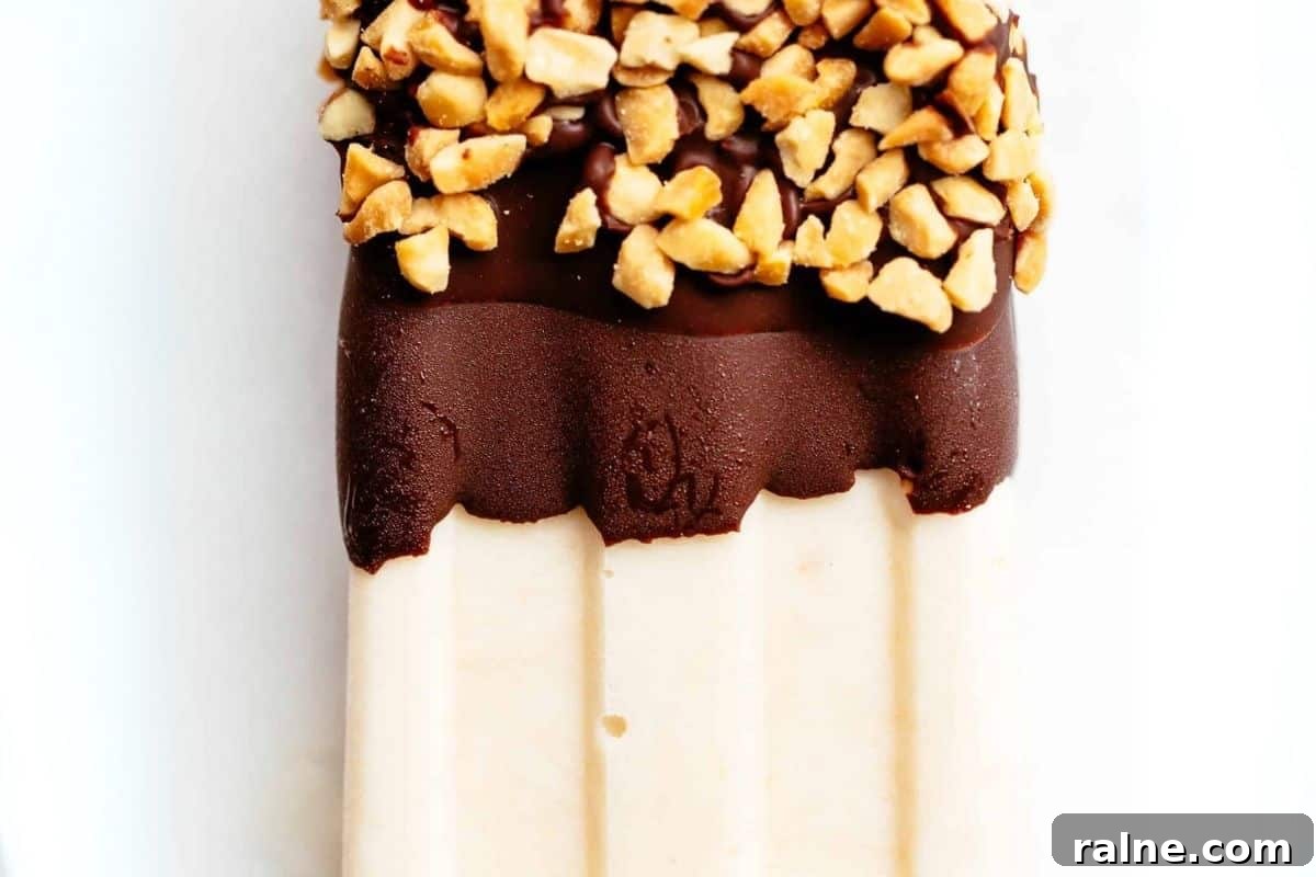 Creamy Banana Popsicle Recipe: 4-Ingredient Frozen Treat 9 Dip each popsicle into the melted chocolate and sprinkle with crushed peanuts.