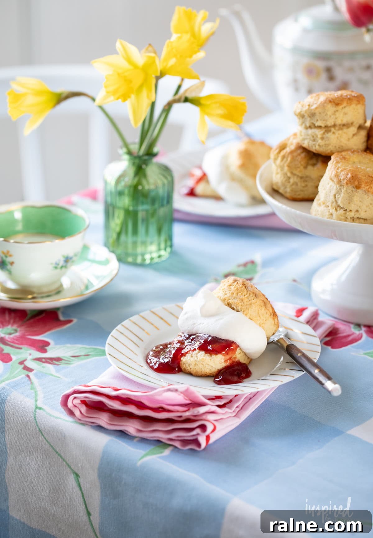 afternoon tea setup with scones served on small plates.