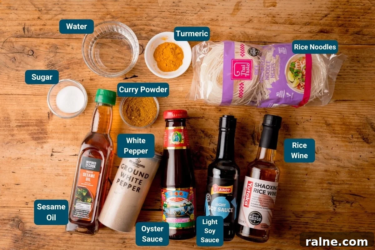 Singapore Stir-Fry Noodles with Curry and Shrimp 4 A variety of labelled cooking ingredients for Singapore Noodles sauce and noodles on a wooden surface, including rice noodles, sauces, spices, water, and sugar.