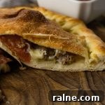 calzone cut in half with fillings coming out