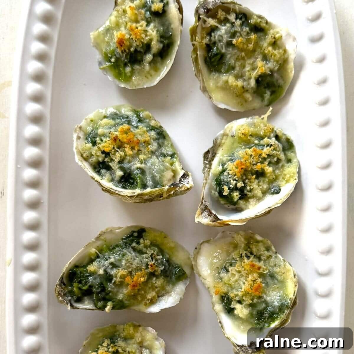 Oysters Rockefeller with Frozen Creamed Spinach: Quick Recipe 14 Baked and plated oysters Rockefeller.