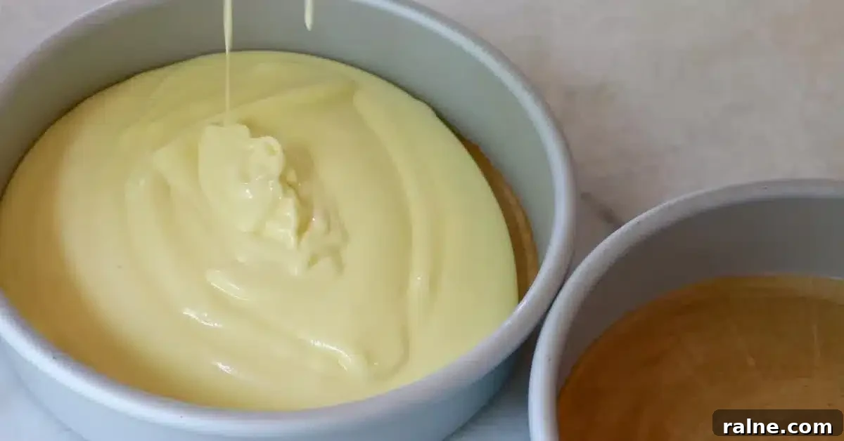 Decadent Strawberry Cream Layer Cake Recipe 10 pouring the cake batter into 2 pans to bake fluffy chiffon cake for strawberry cream cake
