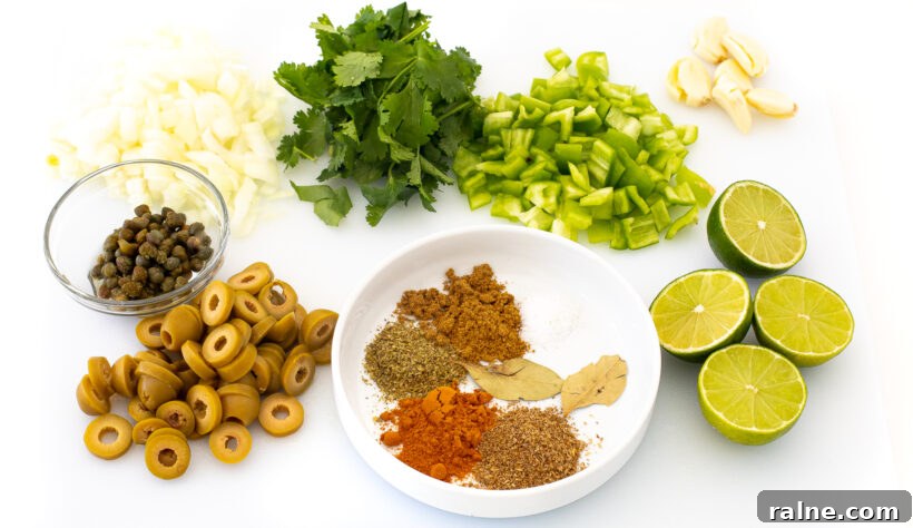 Authentic Latin-Style Chicken and Rice Recipe 3 Ingredients needed for arroz con pollo on a cutting board.