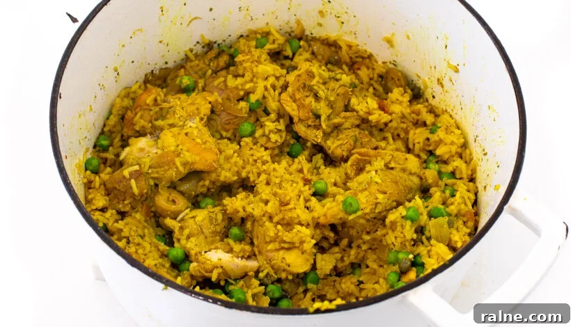 Authentic Latin-Style Chicken and Rice Recipe 8 Chicken and rice in a pot after being cooked.