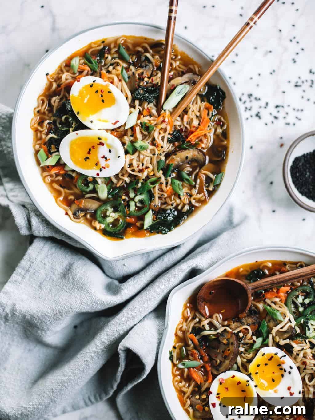 Easy homemade healthy ramen bowls topped with soft boiled eggs, jalapeños and sesame seeds.