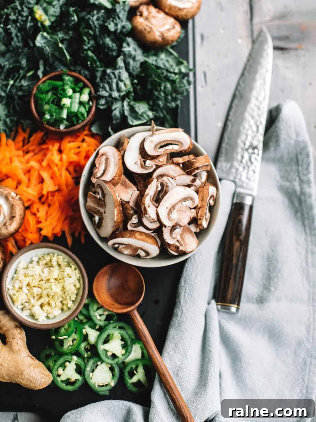 Ingredients like mushrooms, garlic, carrots, kale and green onions for Easy homemade healthy ramen bowls!
