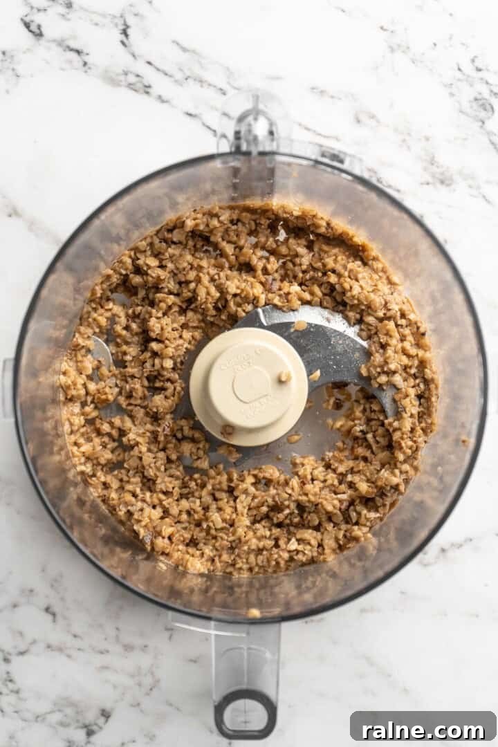 Whether you’re looking for a no-cook dinner or something light and refreshing, you’re going to love these easy Asian-inspired lettuce wraps! Overhead view of minced walnuts in food processor