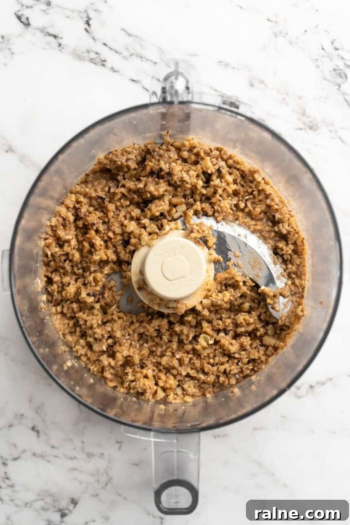 Whether you’re looking for a no-cook dinner or something light and refreshing, you’re going to love these easy Asian-inspired lettuce wraps! Overhead view of walnut meat in food processor