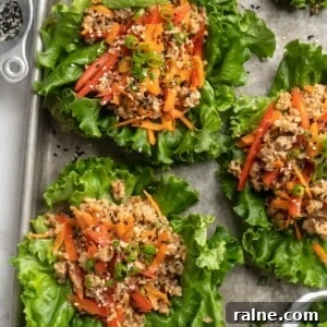 Crispy Chicken Lettuce Wraps with Tangy Asian Sauce 2 Overhead view of walnut meat lettuce wraps on sheet pan