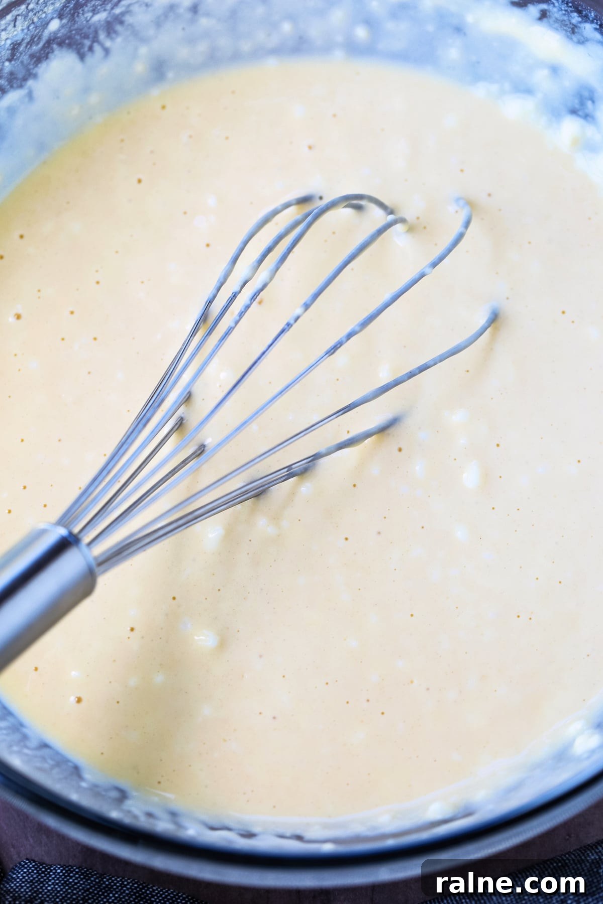 Cottage Cheese Pancakes are a tasty way to get more protein into your breakfast! Fluffy, protein packed pancakes that melt in your mouth! pancake batter in bowl with whisk