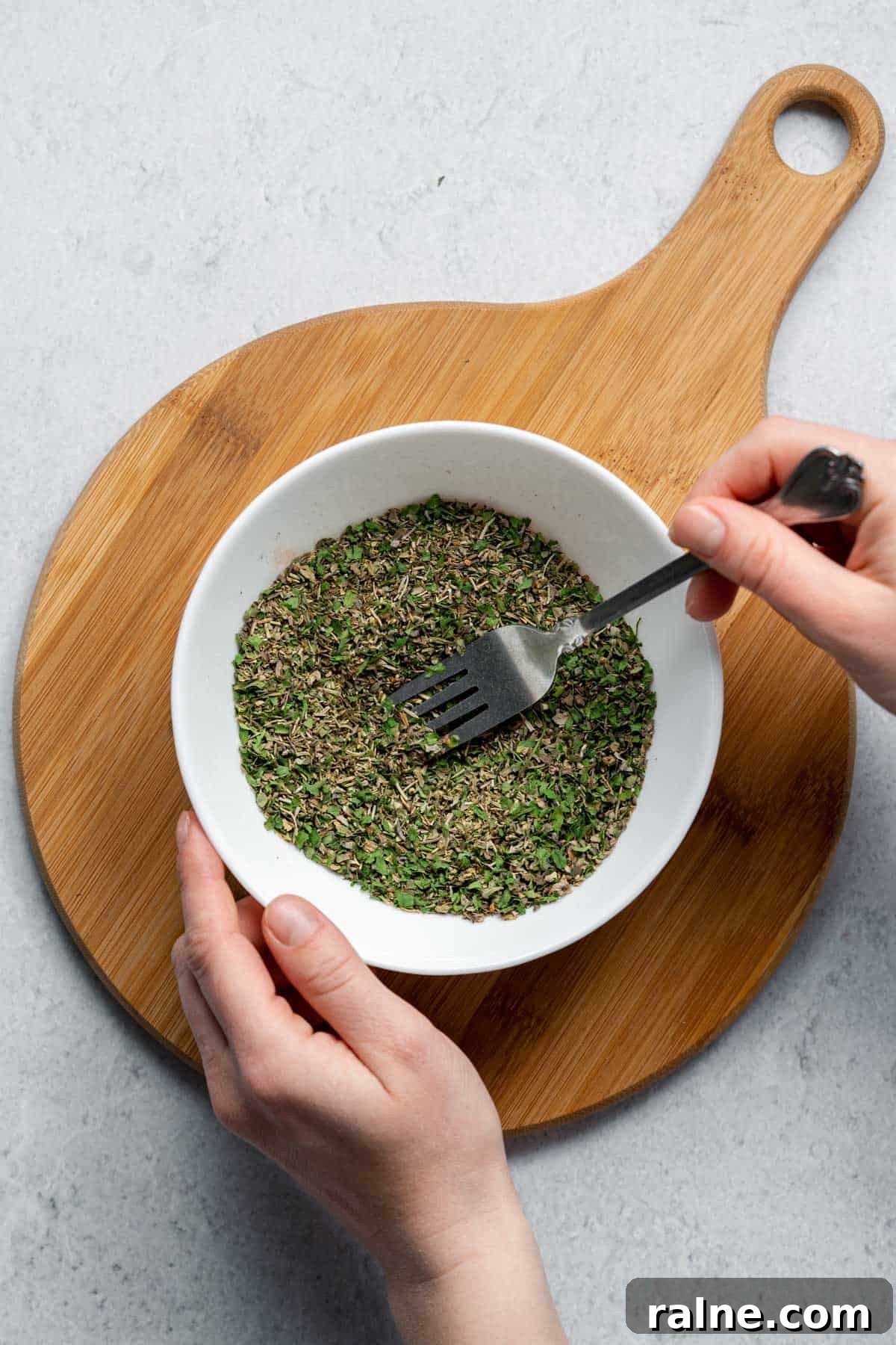 Italian Seasoning From Scratch mixing dried herbs with fork