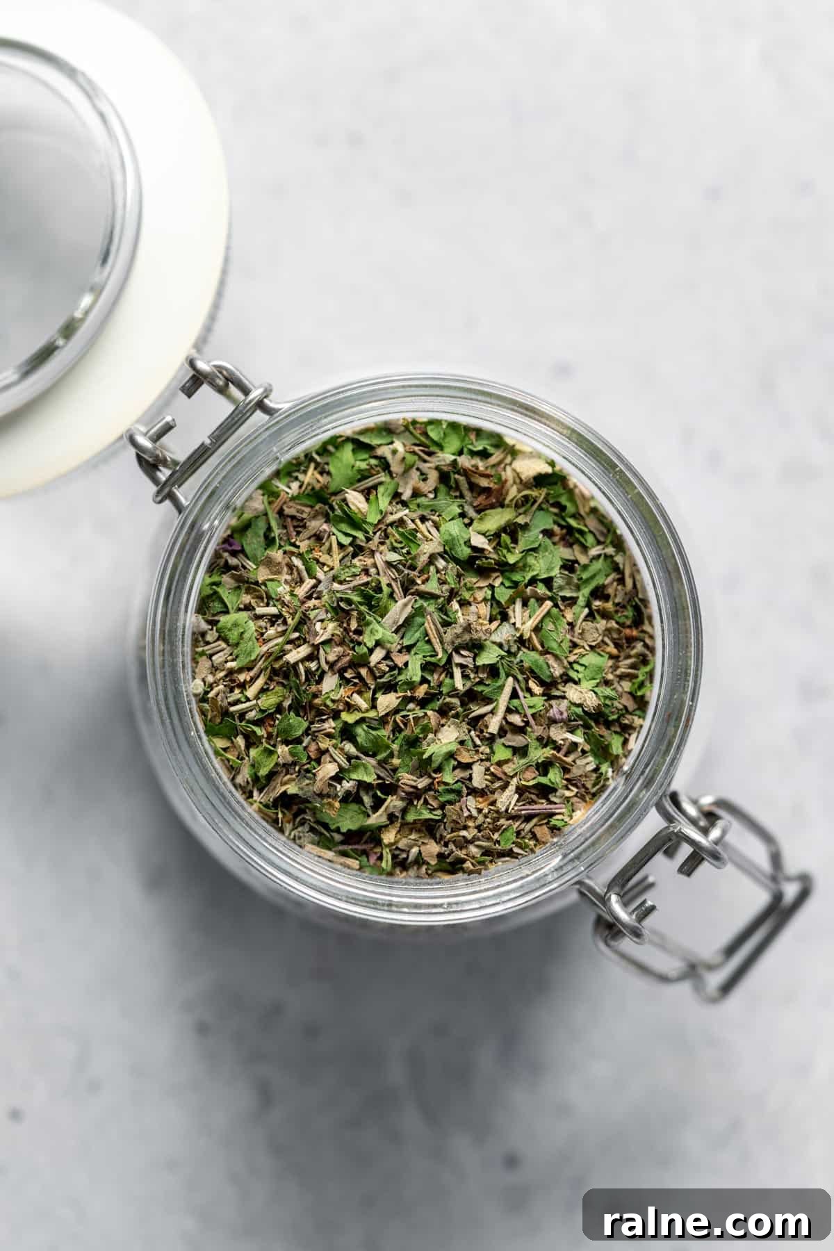 Homemade Italian Seasoning jar filled with dried herbs