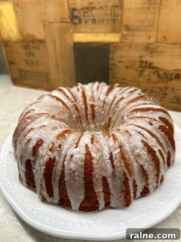 Freshly baked Mountain Dew cake with glaze and coarse sanding sugar garnish