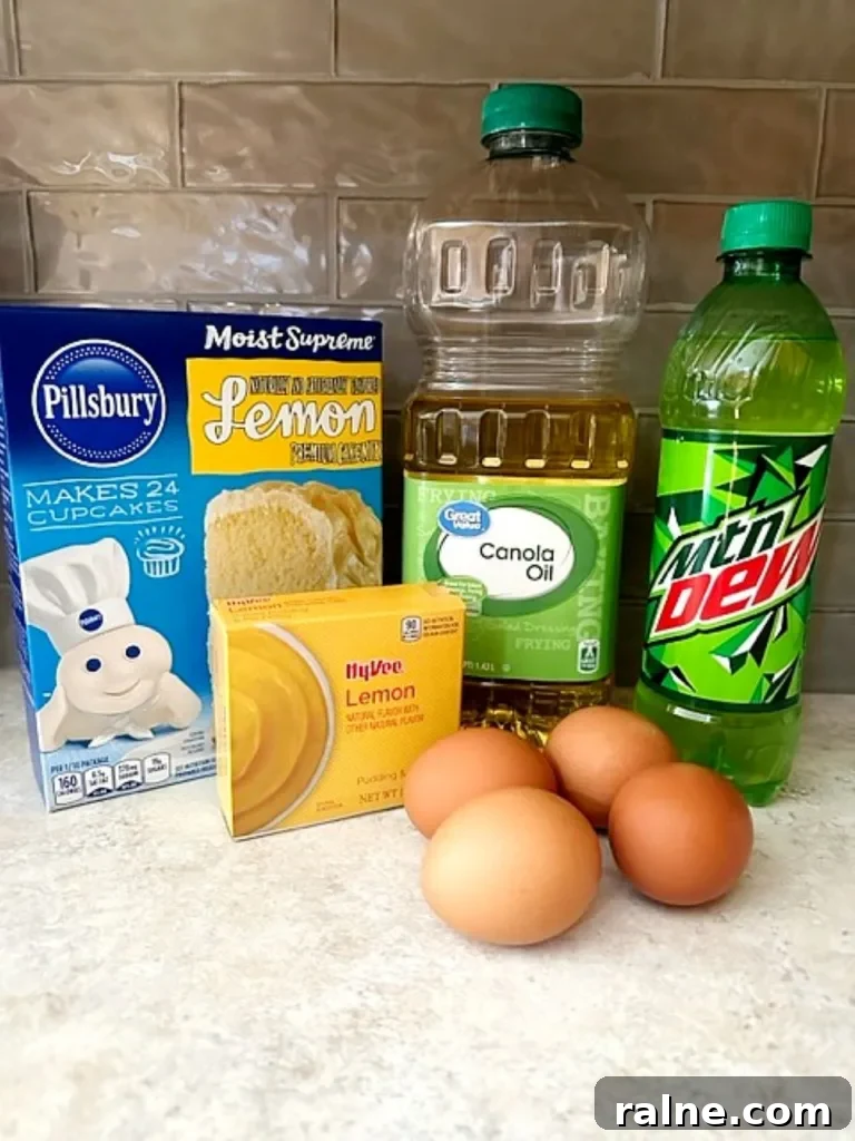 the simple Ingredients for Mountain Dew Bundt cake including lemon cake mix, oil, eggs, and bottles of Mountain Dew on a kitchen counter.
