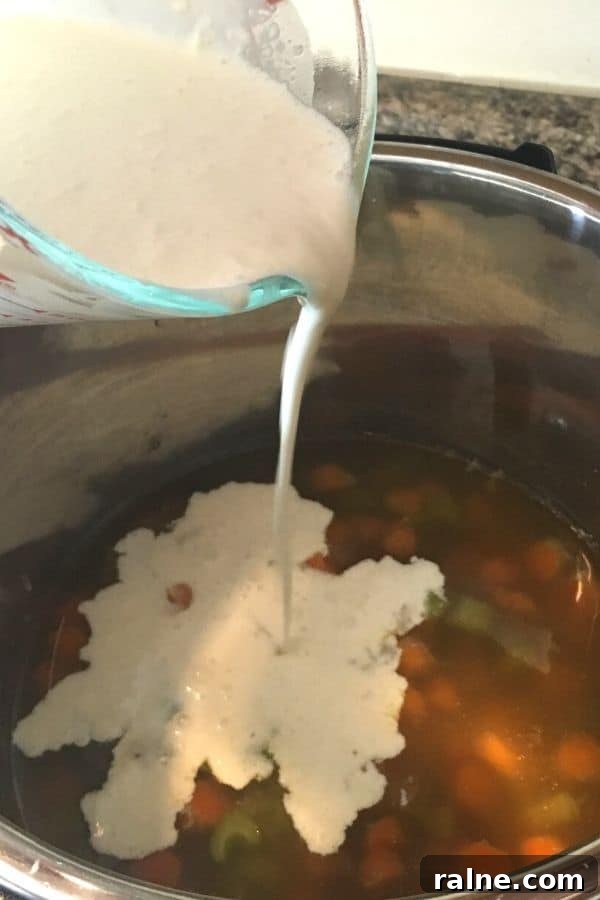 Instant Pot Chicken Pot Pie with Pie Crust or Biscuit Topping 7 Flour and cream slurry being added to the Instant Pot to make chicken pot pie filling.