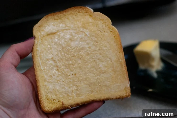 Holding Buttered Bread.