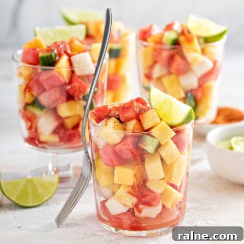 Authentic Mexican Fruit Cups (Vasos de Fruta) — Street Snack Recipe 12 chopped fruit in cups sprinkled with tajin and chamoy sauce