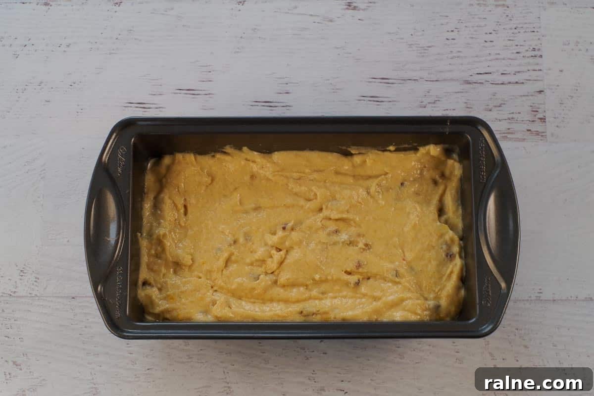 Dairy-Free Pumpkin Walnut Bread Recipe 12 Batter in loaf pan.