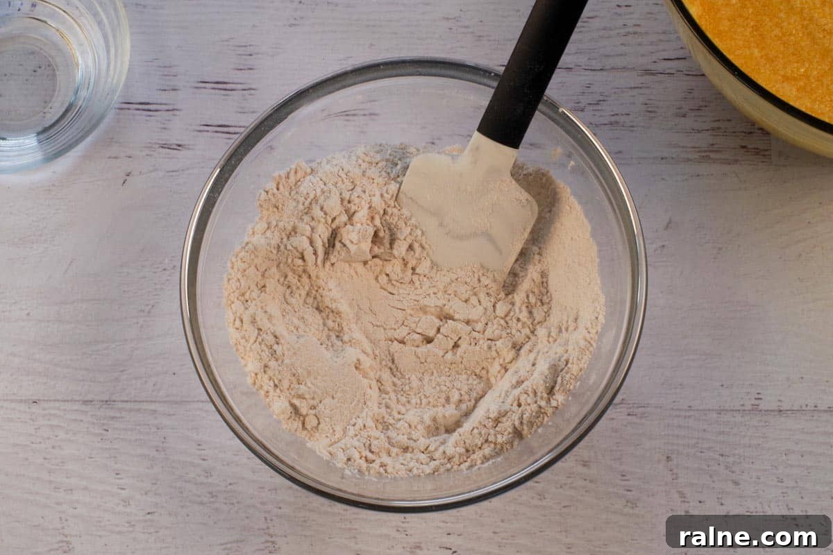 Dairy-Free Pumpkin Walnut Bread Recipe 8 Dry ingredients in medium glass bowl.