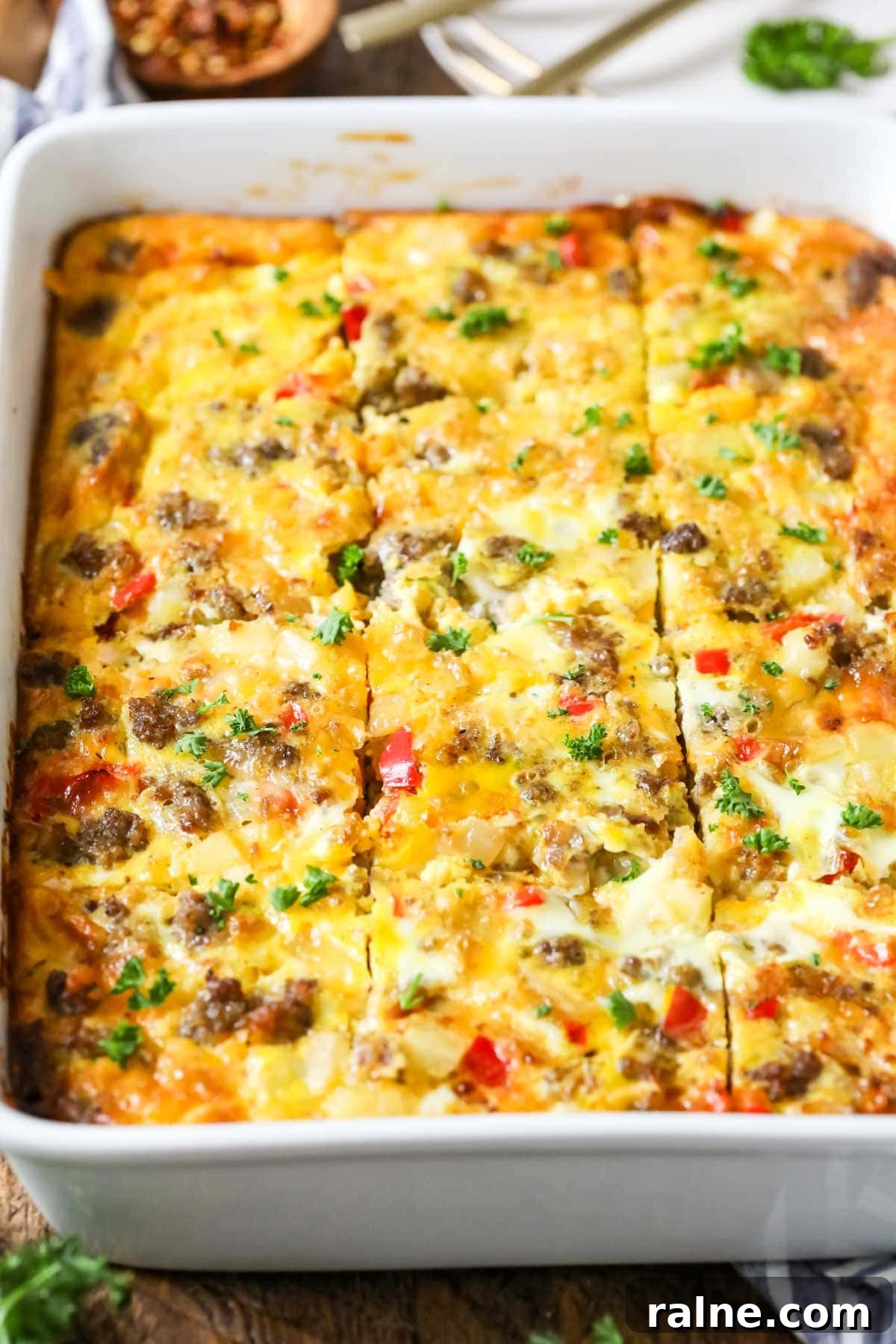 Hearty Breakfast Casserole Recipe for Busy Mornings 2 Close-up view of a breakfast casserole that's been cut into squares.