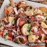 Creamy Red Potato Salad with Fresh Herbs and Dijon Dressing 5 Close up view of red potato salad.