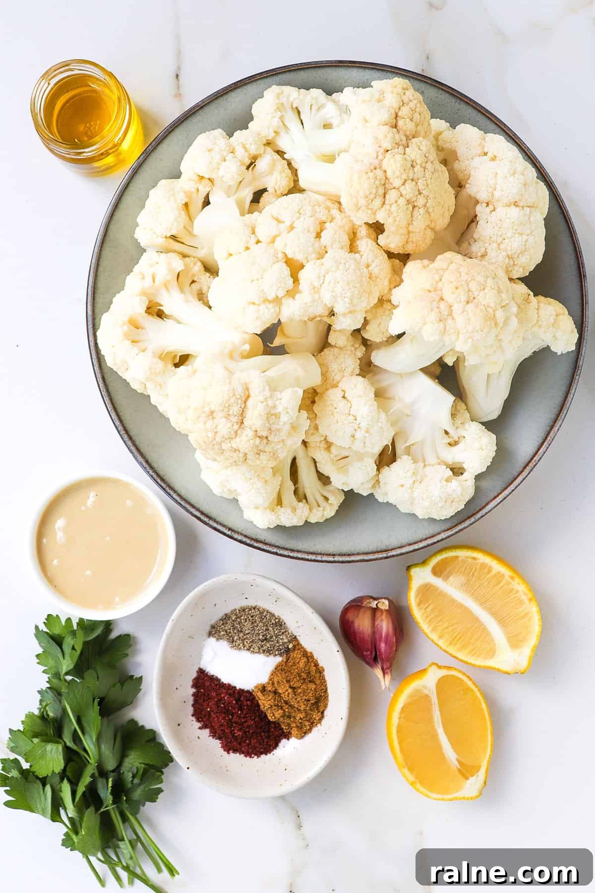 Sumac-Roasted Cauliflower with Creamy Tahini Sauce 4 Ingredients shown to make roasted sumac cauliflower.