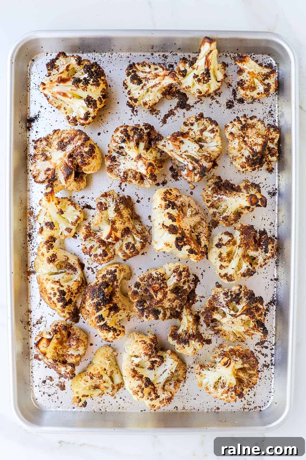 Sumac-Roasted Cauliflower with Creamy Tahini Sauce 6 Roasted cauliflower on a baking sheet.