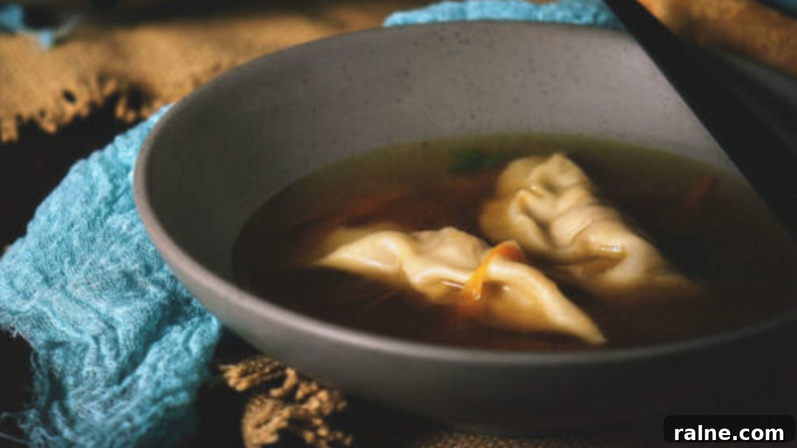 17 Comforting Soup Recipes for Quiet Evenings 3 Dumpling soup with homemade dumplings floating in seasoned broth.
